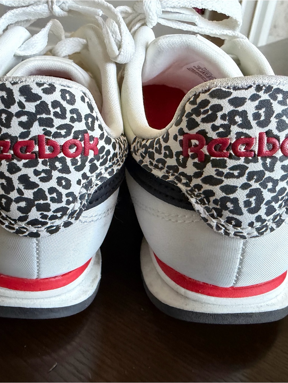 Reebok Kids White Sneakers with Black Leopard Print and Red Accents